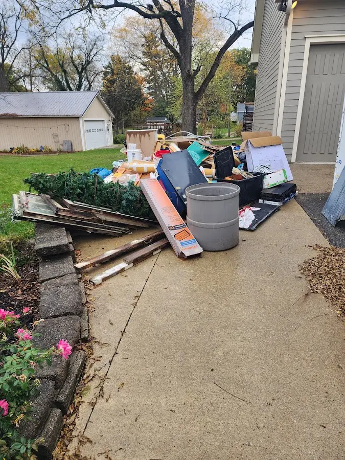 Dumpster being loaded with debris for Estate Cleanout Dumpster Rental in Conemaugh